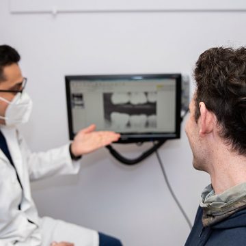 Dentist Communicating with Patient