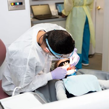 Dentist treating a child